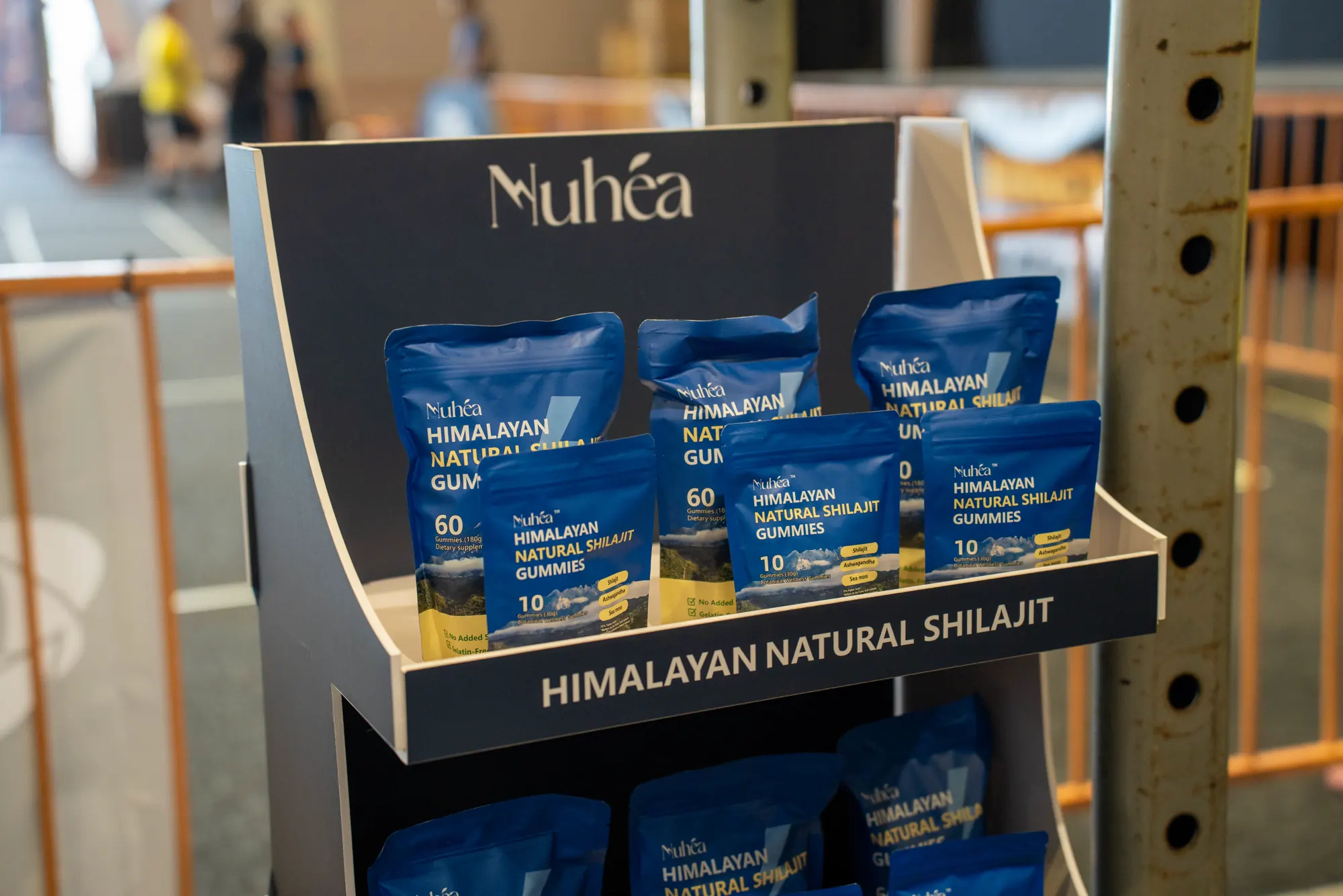 Nuhéa shilajit gummies displayed at the event booth