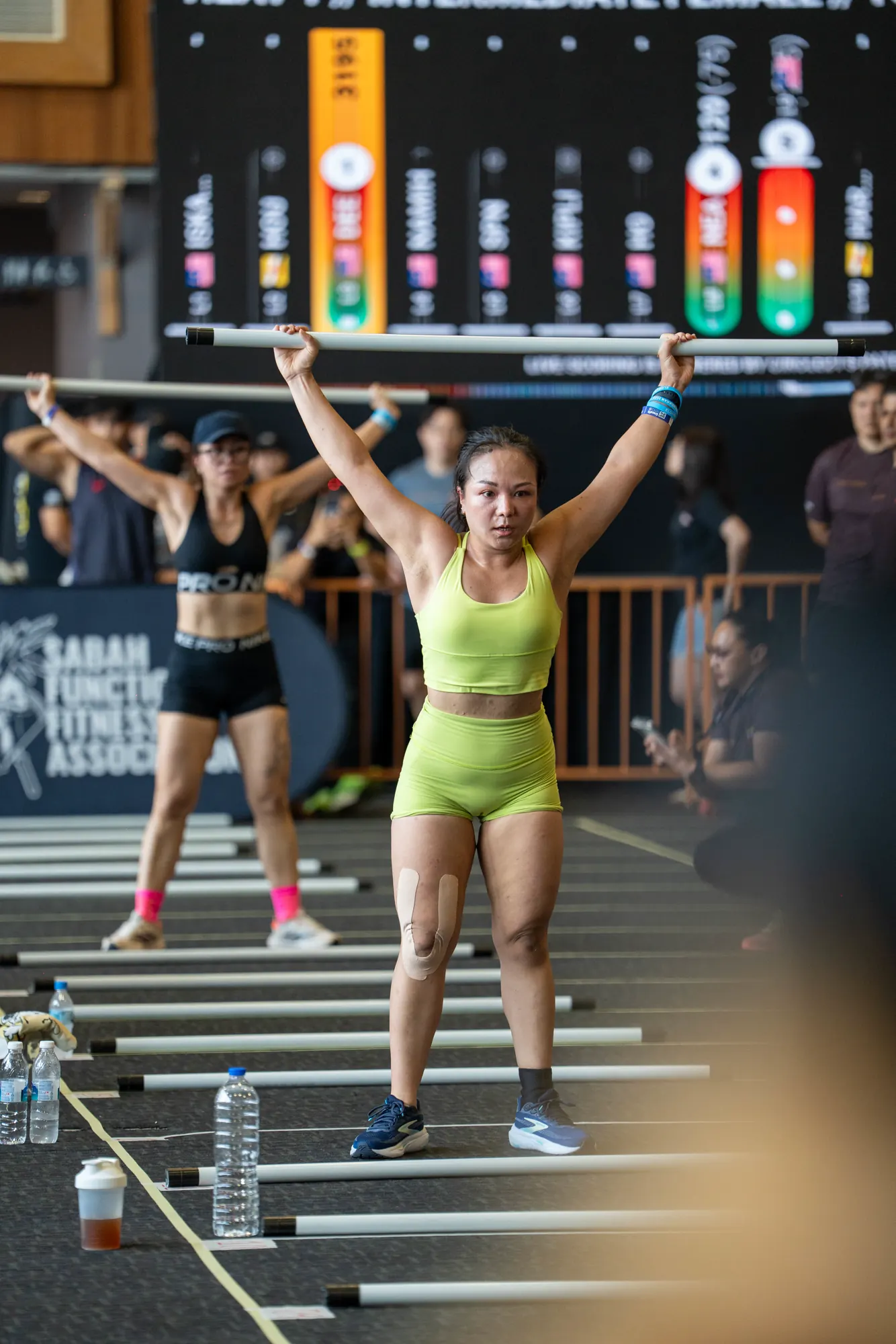 CrossFit athlete completing a barbell lift