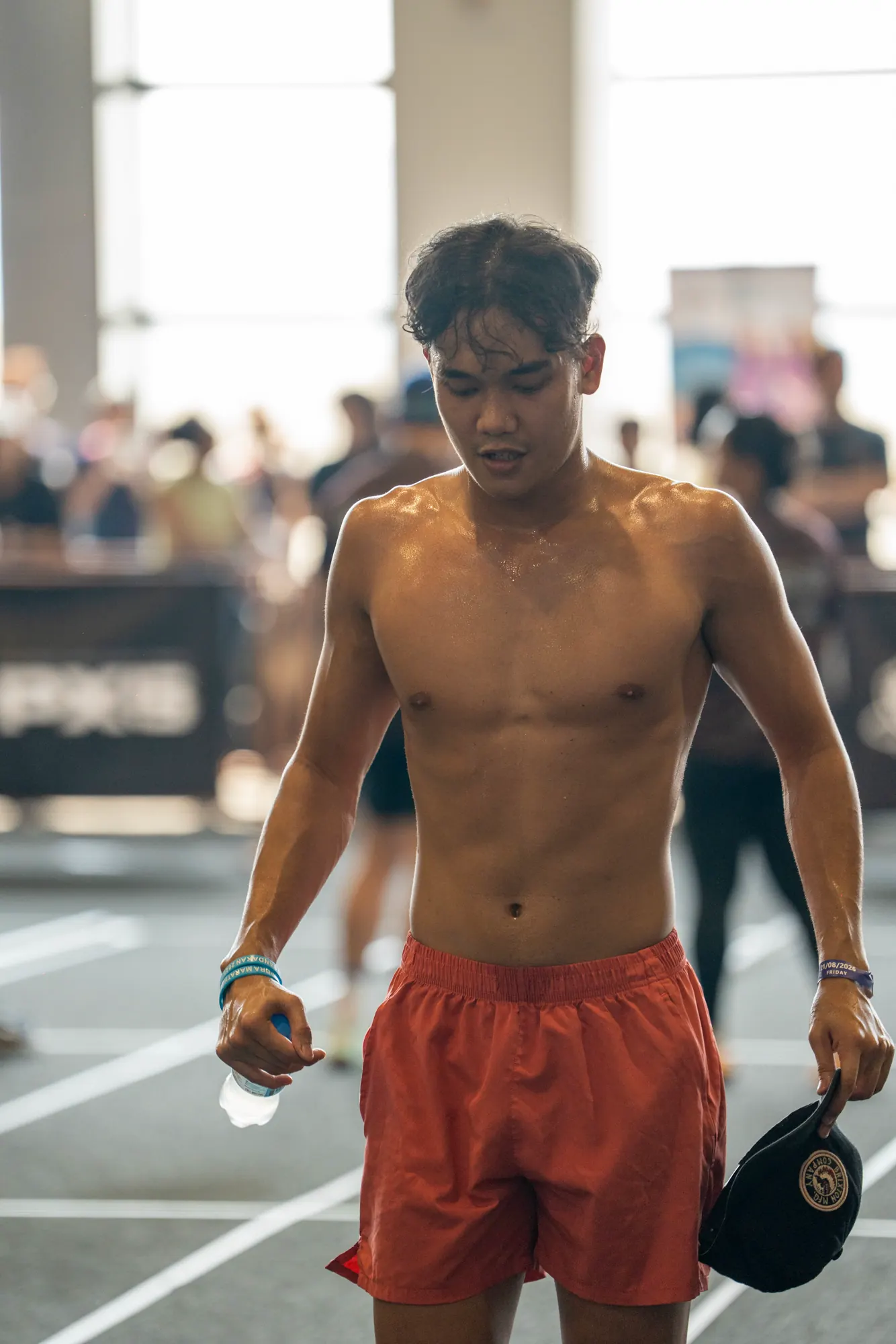 Competitor carrying weights during a Day 1 heat