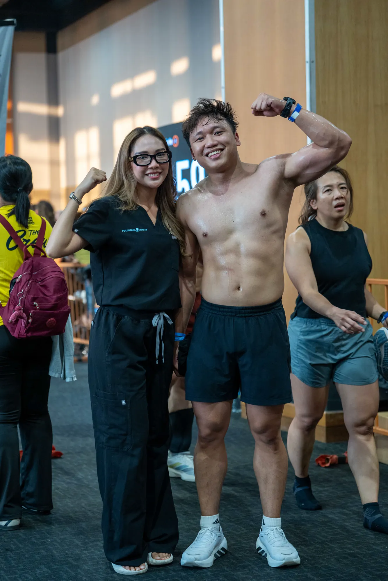 Day 1 competitors posing together at the venue