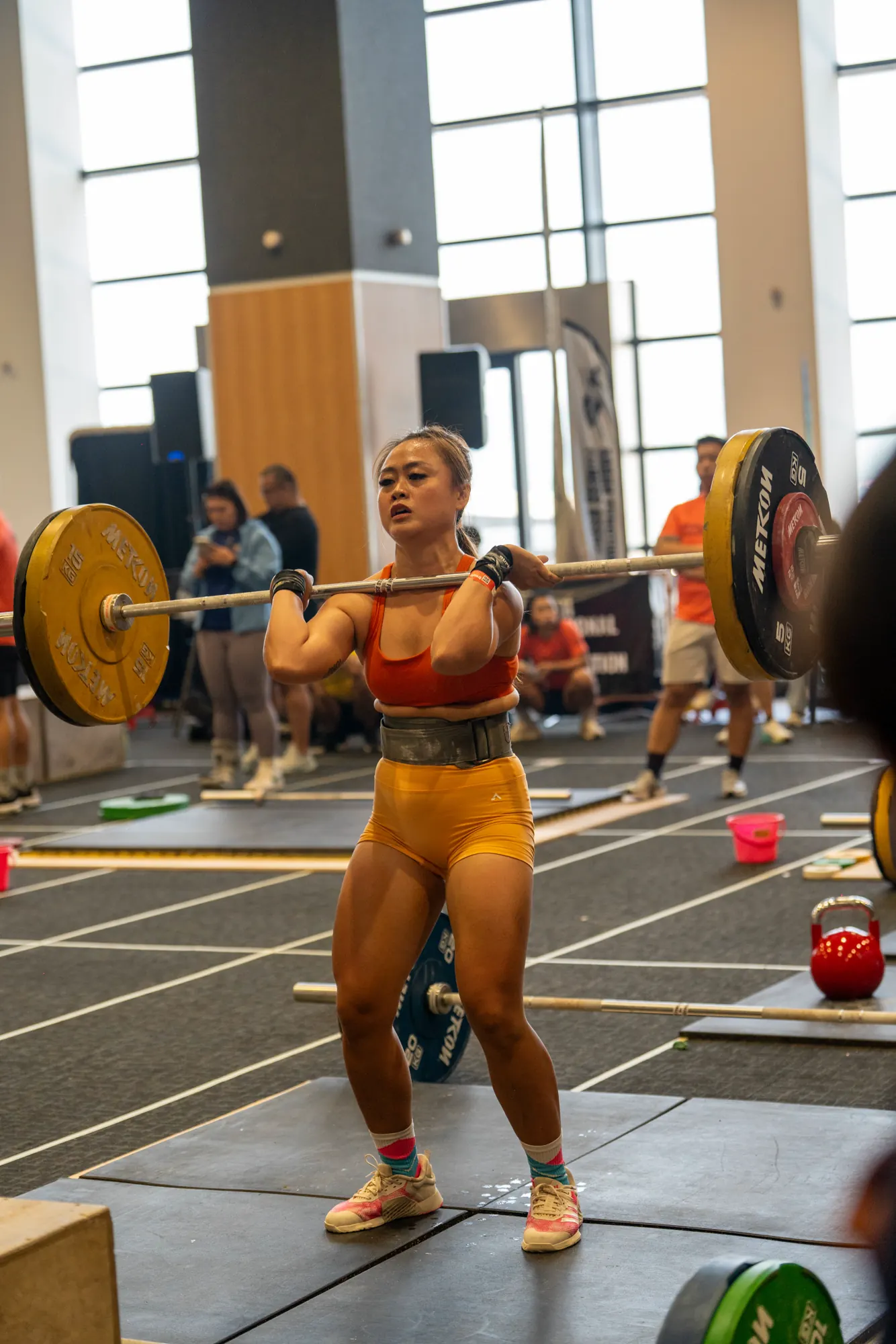 Athlete lifting a loaded barbell during Day 2