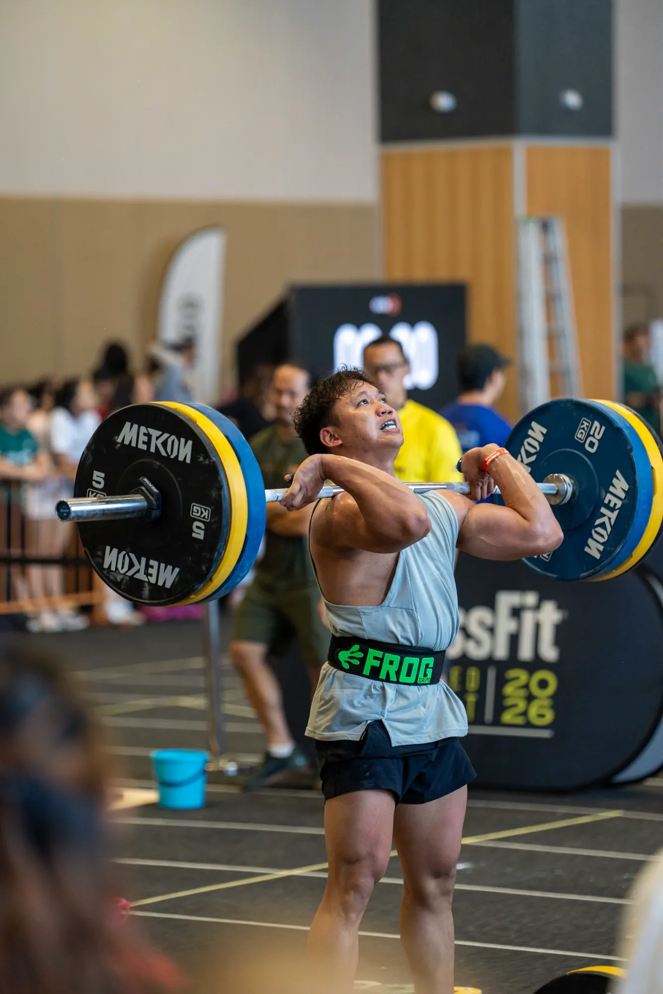 Competitor completing a barbell movement