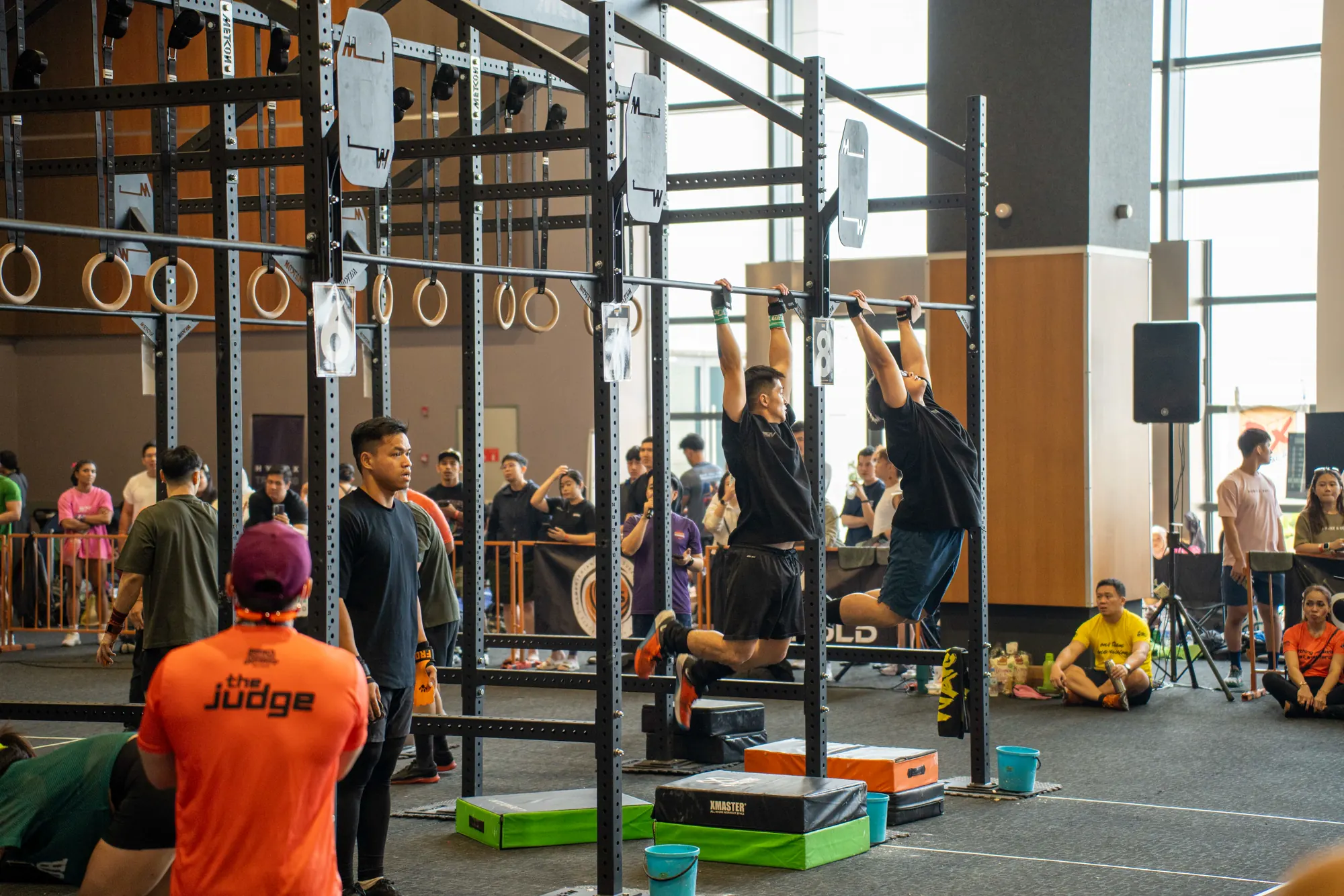 Competition action around the pull-up rigs