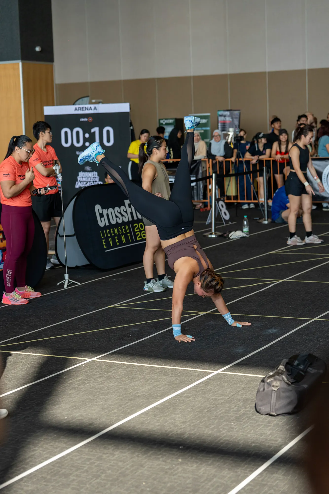 Competitor pushing through a floor movement