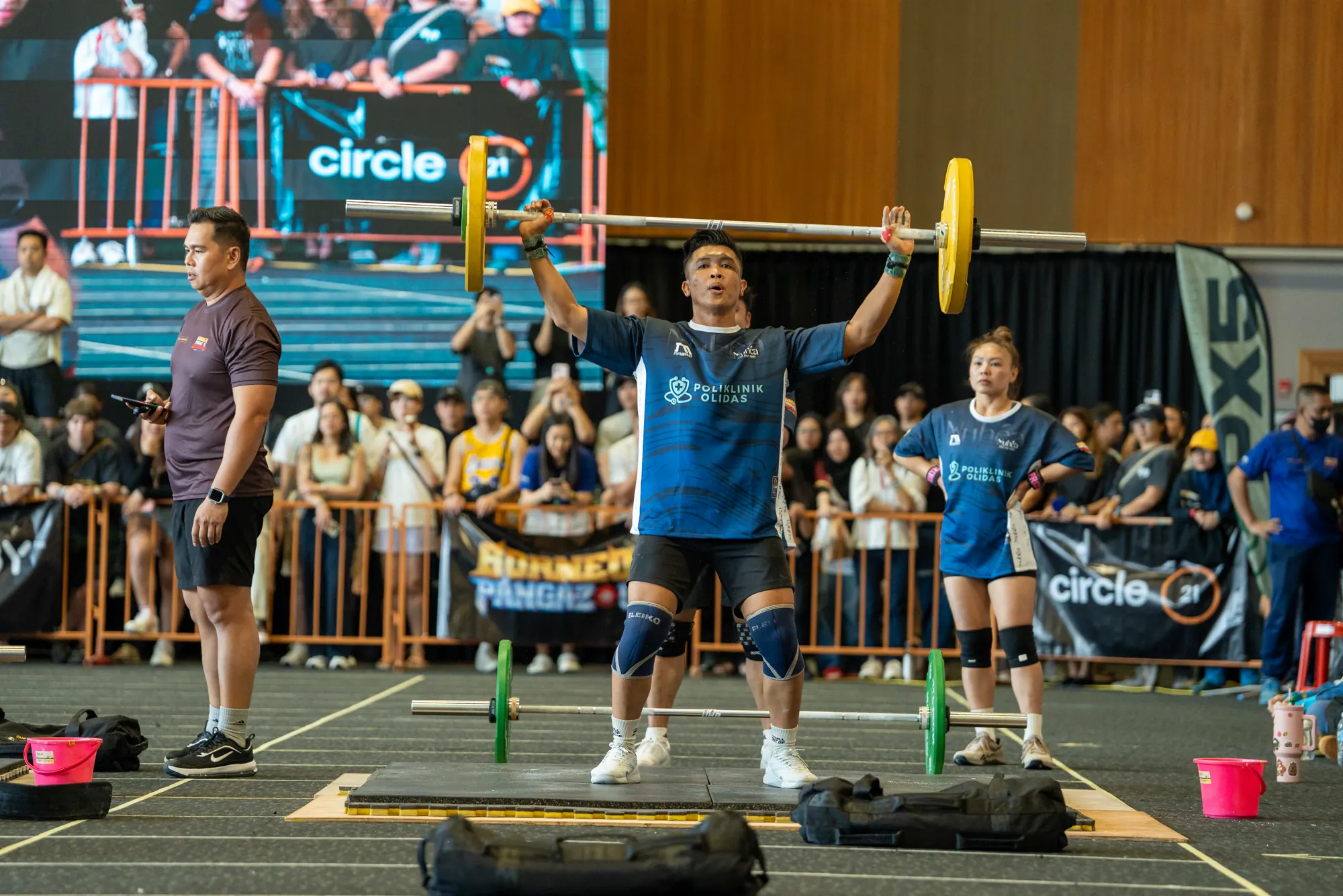 Athlete celebrating at the finish of a workout