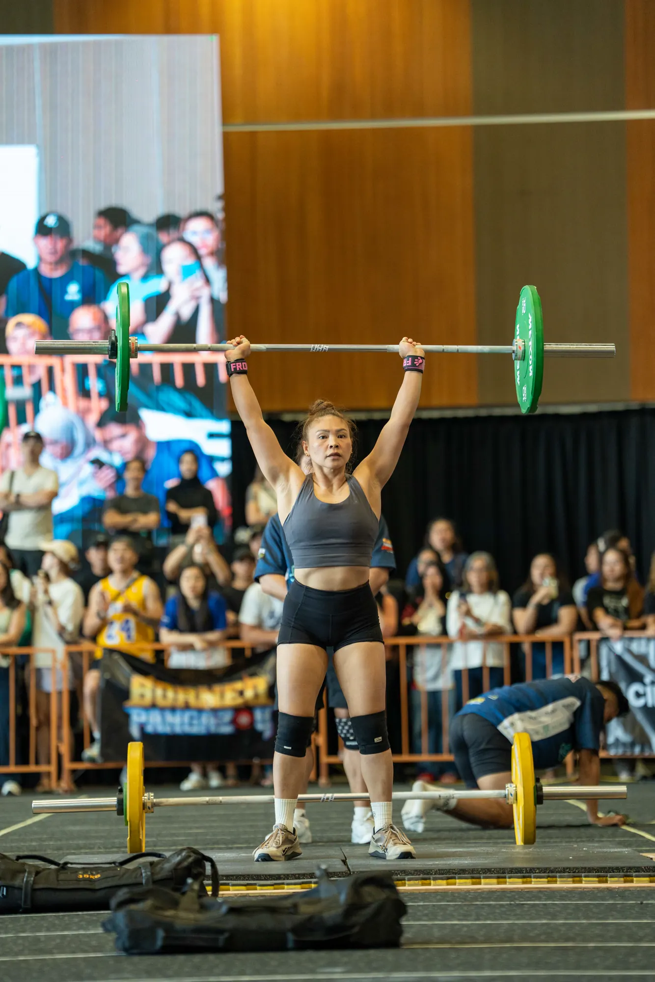 Competitor completing an overhead lift